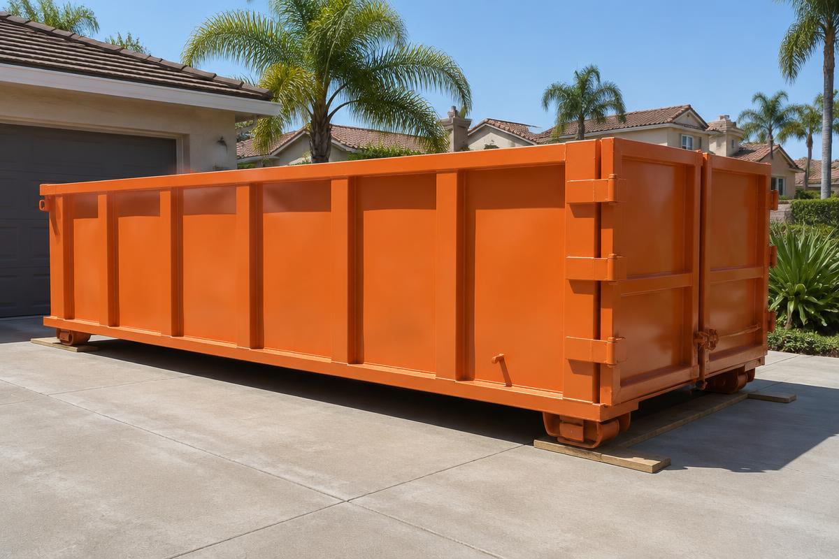 20 yard roll-off dumpster on a driveway at a home renovation